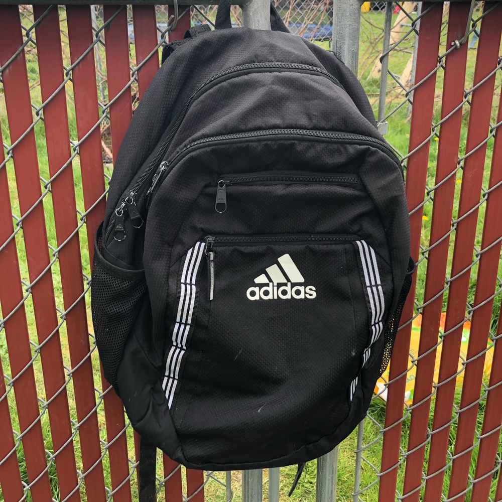 adidas Black Backpack with White Logo and Stripe Accents 4 Zippers area.